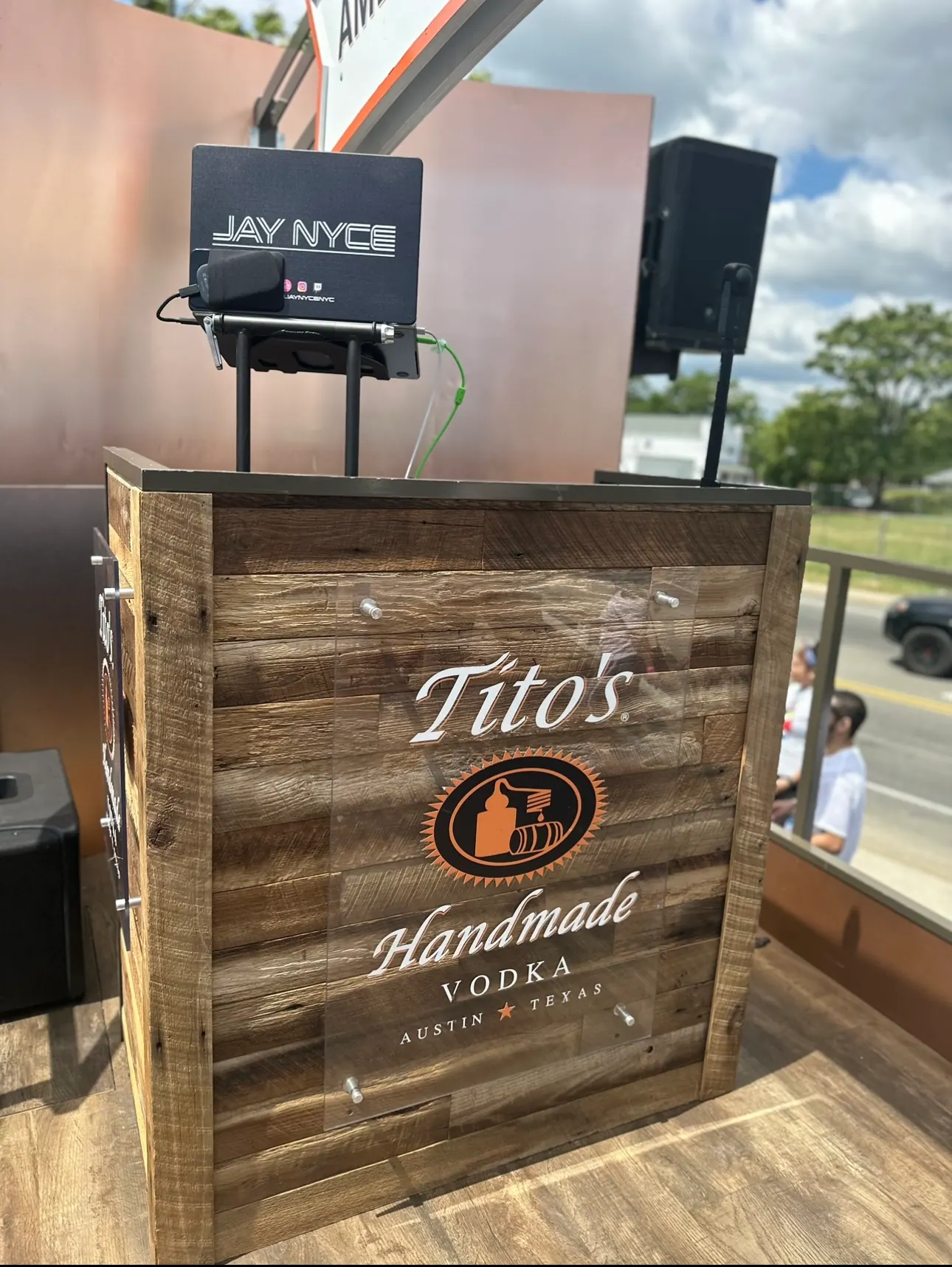 Tito's Vodka branded DJ booth with monitors
