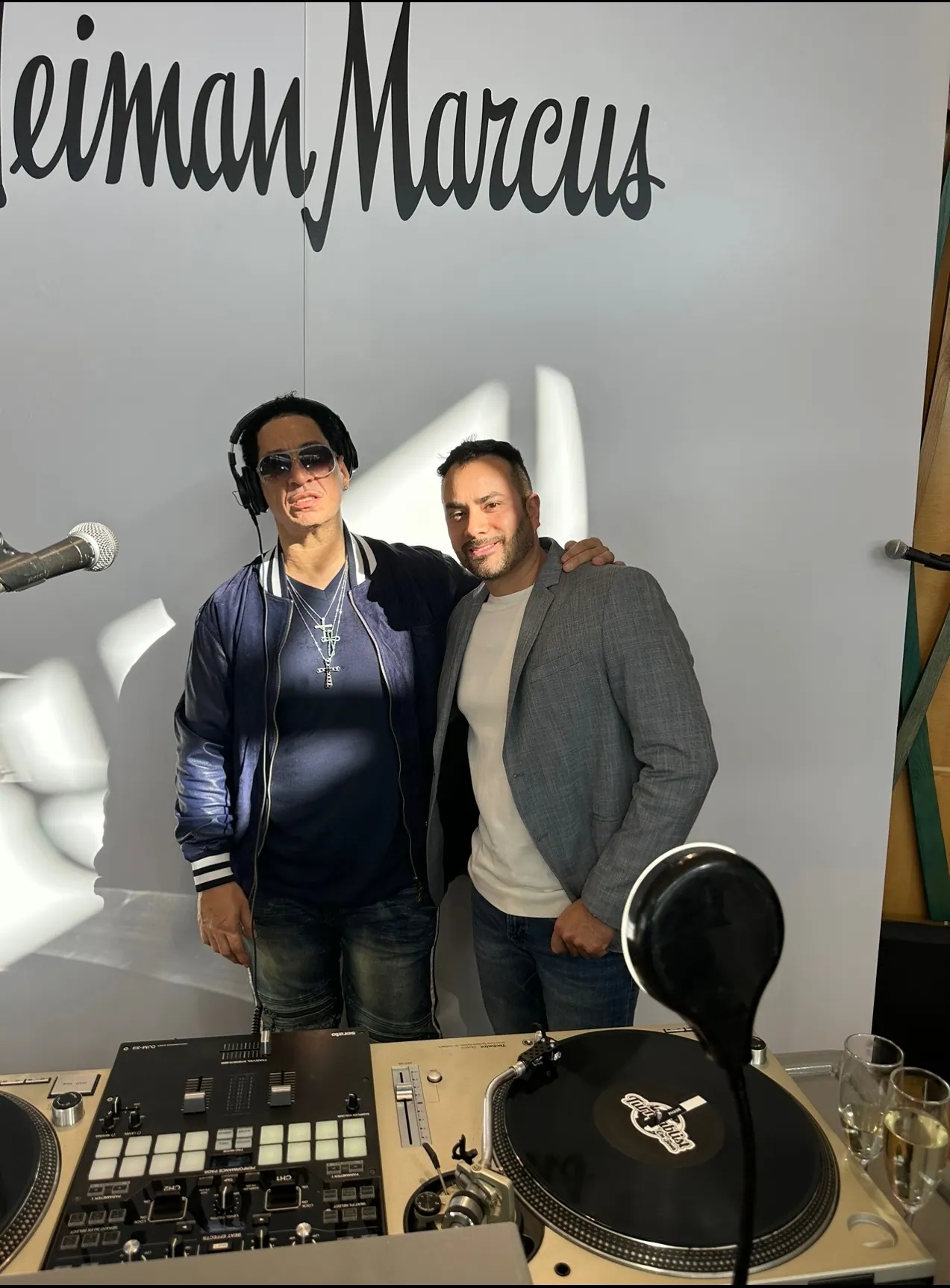 DJ Jay Nyce with a guest DJ at a Neiman Marcus in-store event