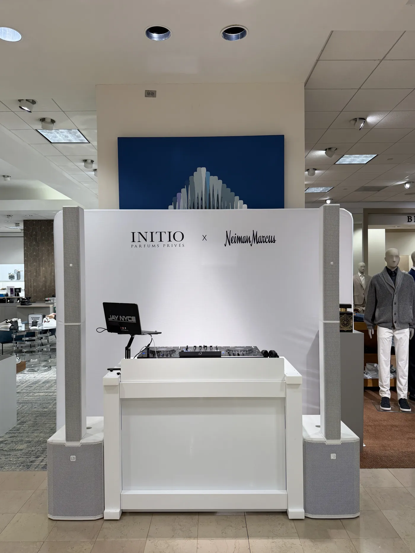 JN Event Entertainment DJ booth and white column speakers at a Neiman Marcus fragrance night